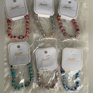 Superstar bracelets new in package multi color bracelets